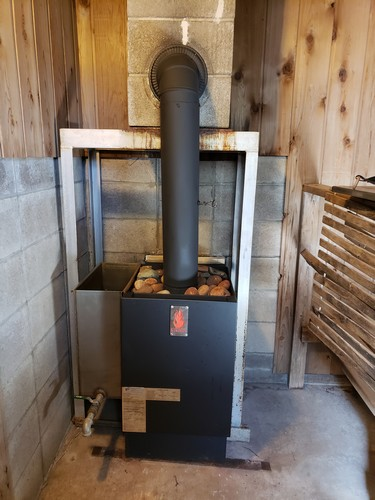Sauna Stoves Kuuma picture of sauna stove installed and working in sauna